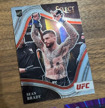 2022 Donruss Select UFC Sean Brady Rated Rookie Purple /99 Tri Prizm Octa 3 Card (Single)