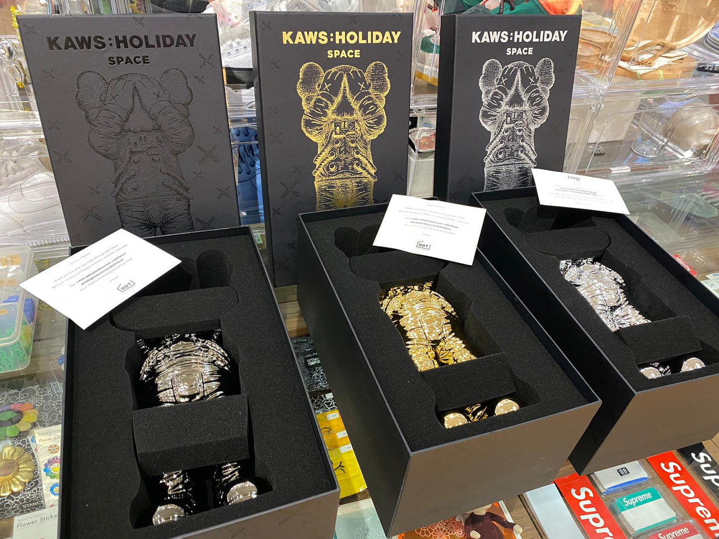 KAWS Holiday Space Figure Gold/Black/Silver Set