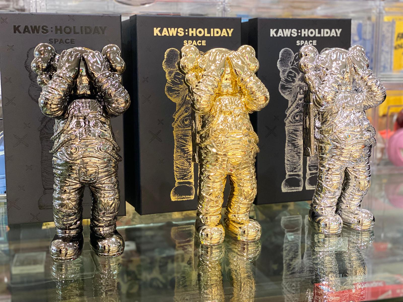 KAWS Holiday Space Figure Gold/Black/Silver Set