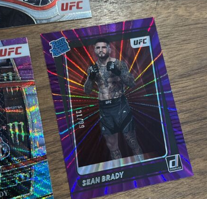 2022 Donruss Select UFC Sean Brady Rated Rookie Purple /99 Tri Prizm Octa 3 Card (Single)